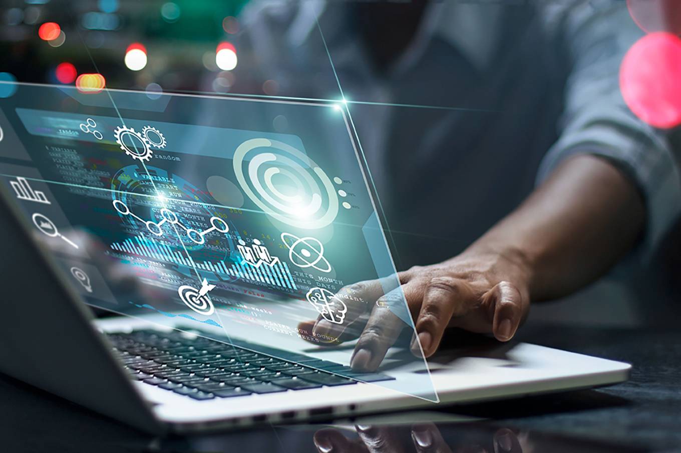  Male programmer using laptop analyzing and developing in various information on futuristic virtual interface screen