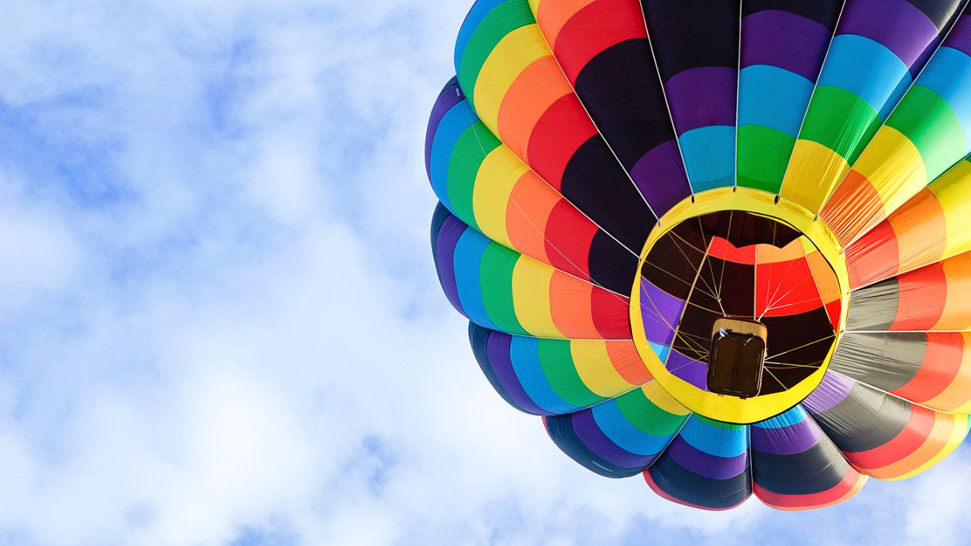 A multicolored hot air balloon in the sky