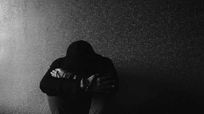 Depressed man in hoodie