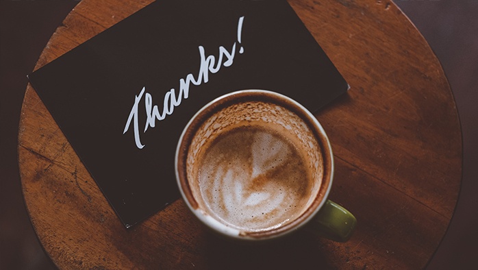 Coffee cup with thank you card