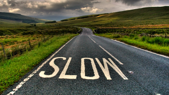 Road markings saying Slow.