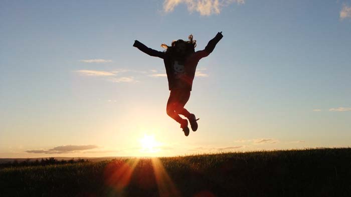 A child jumping in the air. 
