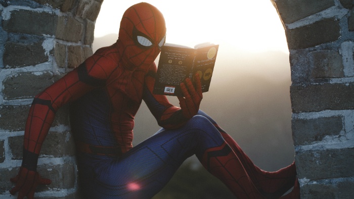Spiderman reading a book