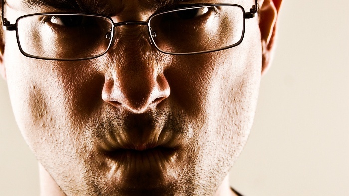 A man scrunching up his mouth.