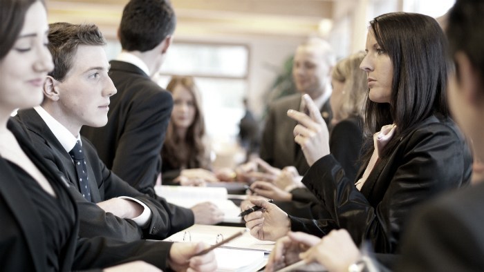 People sitting around a table having a discussion.