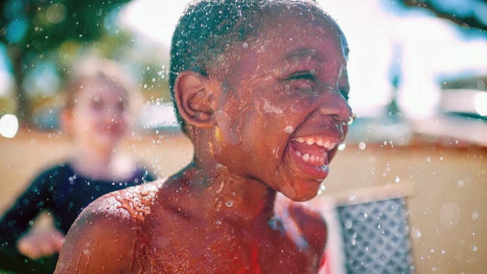Boy laughing in the water