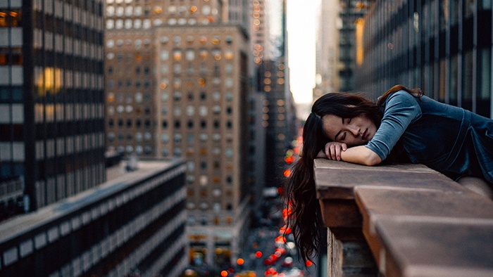 Girl lying on ledge