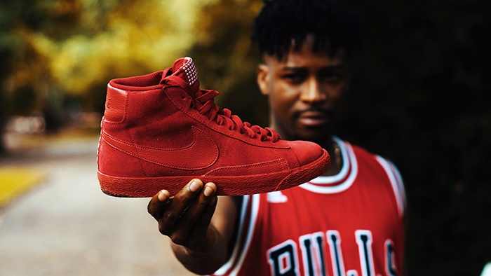 Man holding red basketball shoe