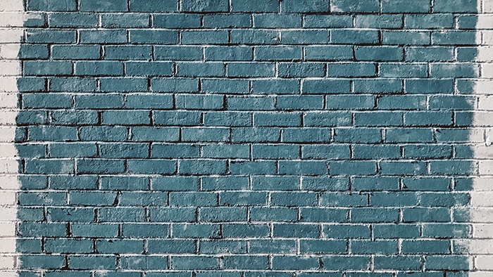 Brick wall painted blue and white